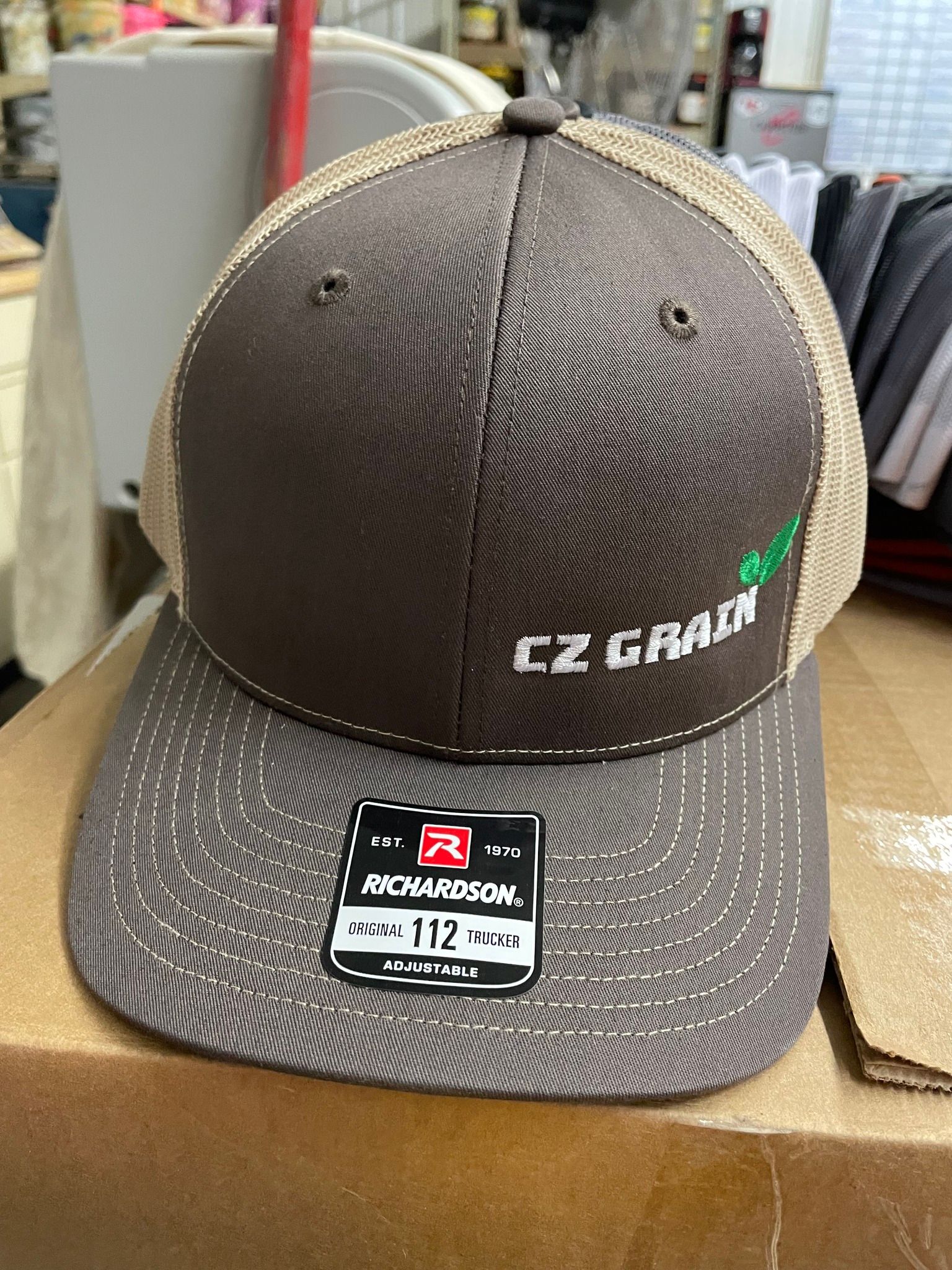 A richardson hat is sitting on top of a cardboard box.