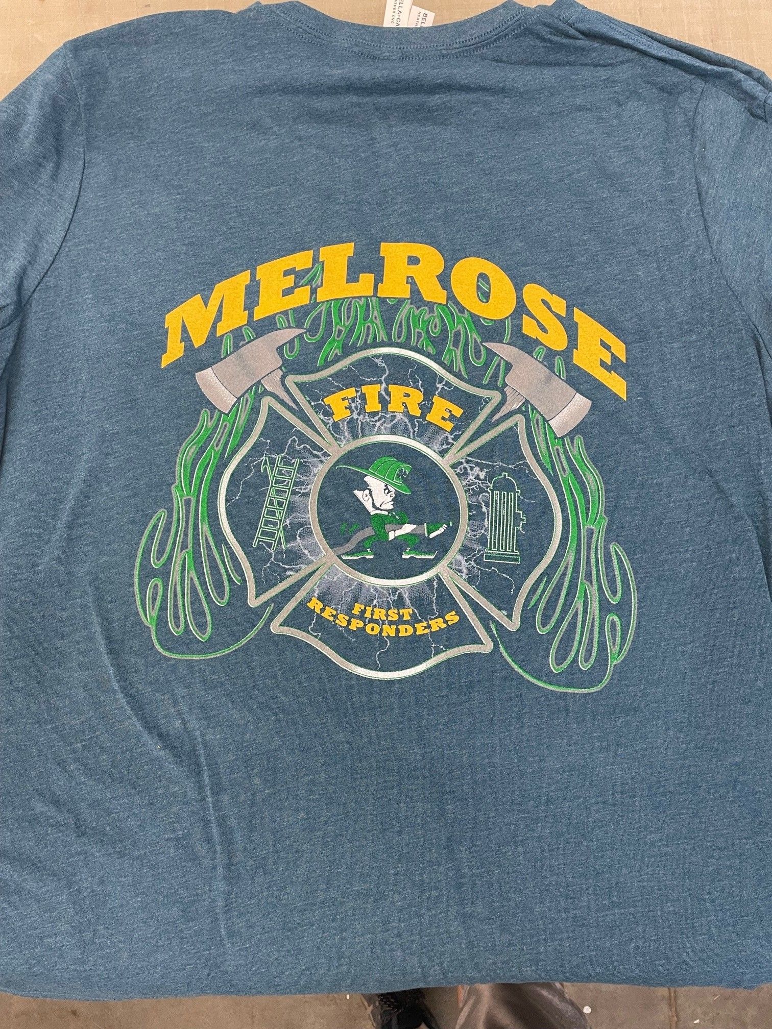 A blue t-shirt with the word melrose on it