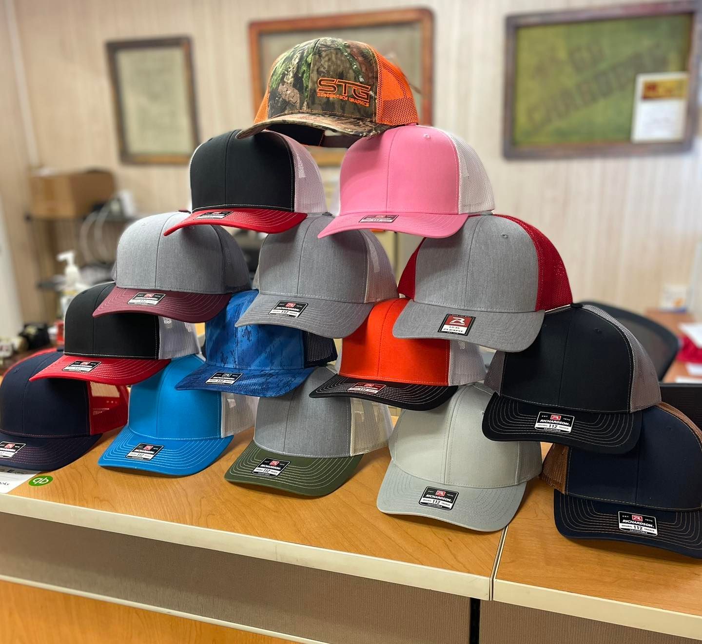 A bunch of hats are stacked on top of each other on a table