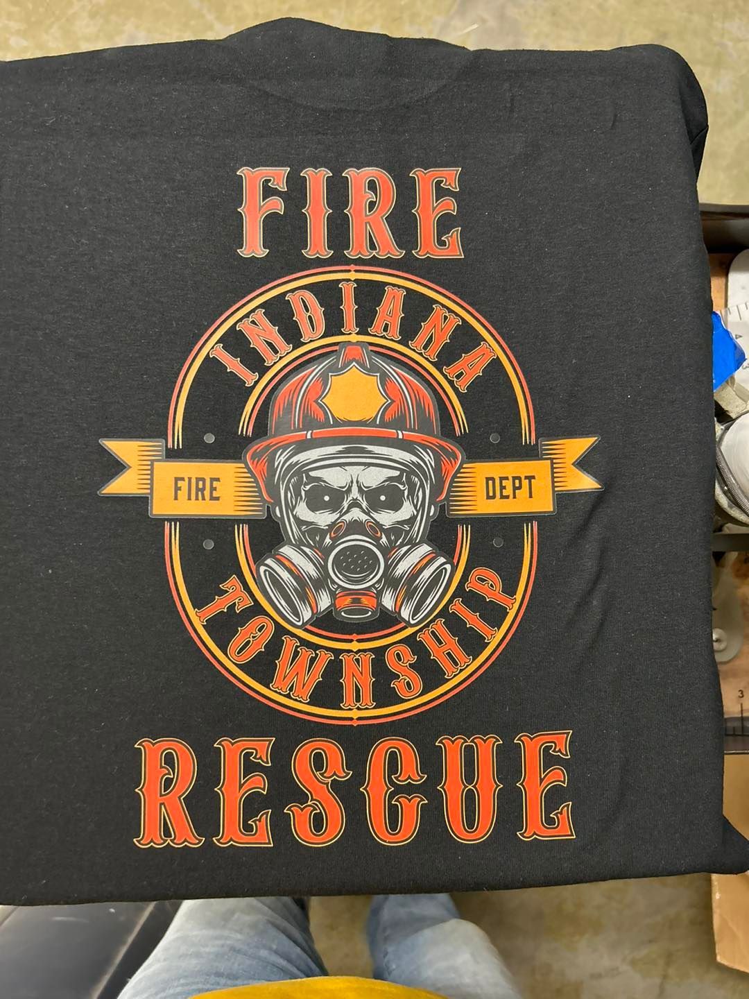A black shirt that says fire indiana township rescue