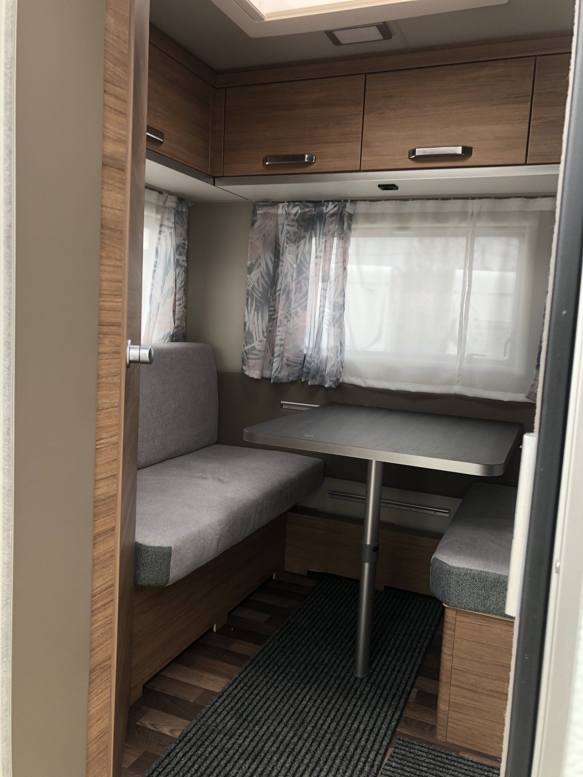 A small room with a table and a couch