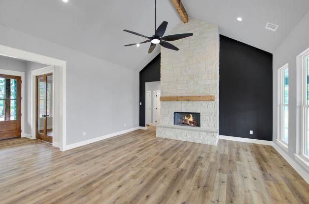 A modern living room with a fireplace.