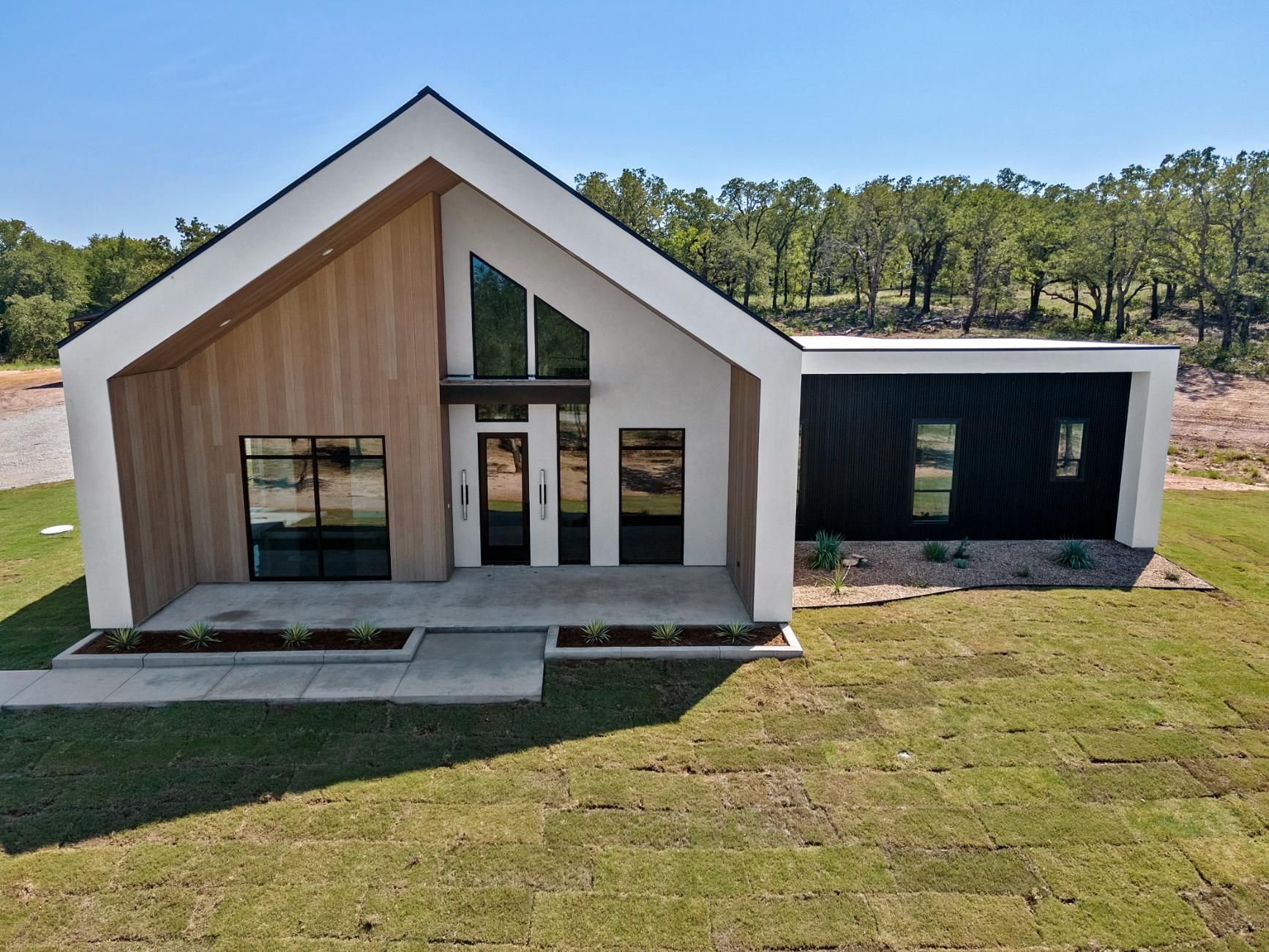 A white house with a black roof.