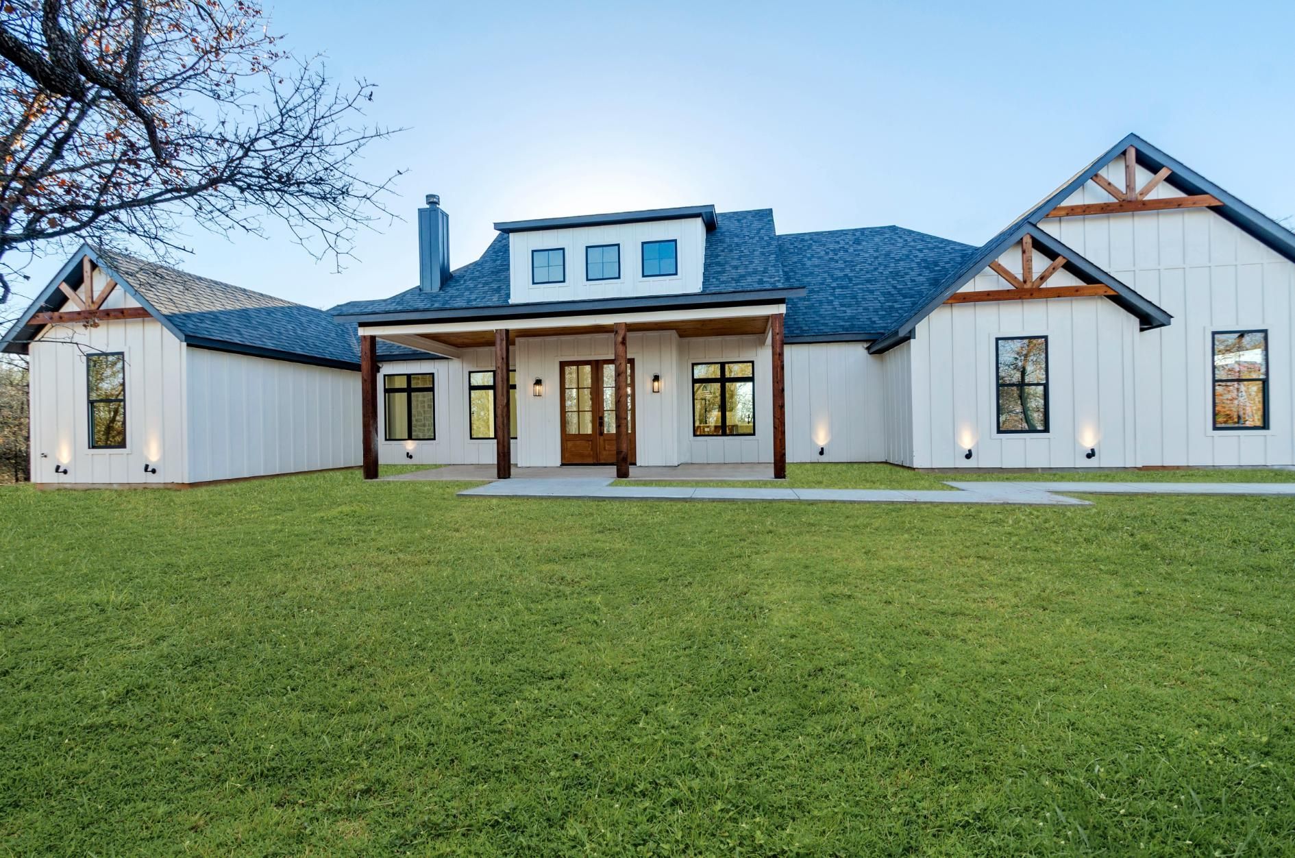 A large white house with a blue roof.