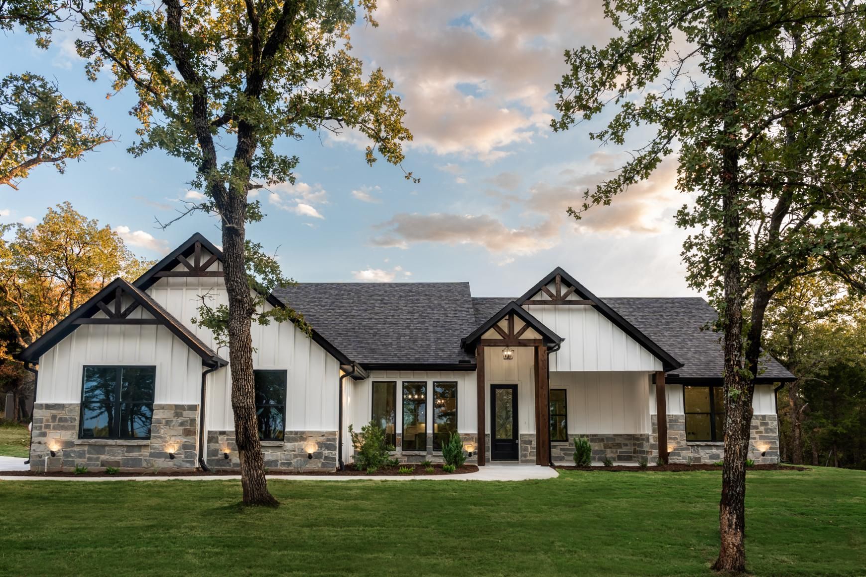 A large white house with a black roof.