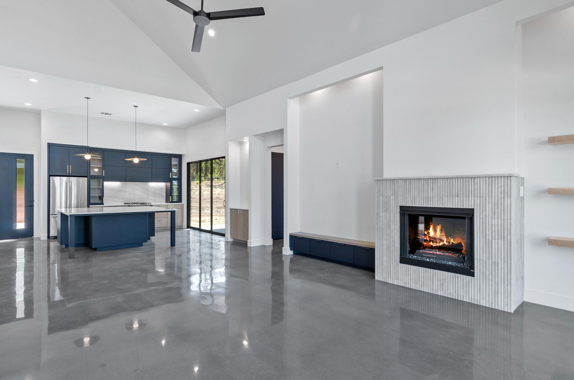 A fireplace in the middle of the living room.