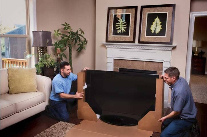 Men holding a box - Moving Companies in Everett, WA