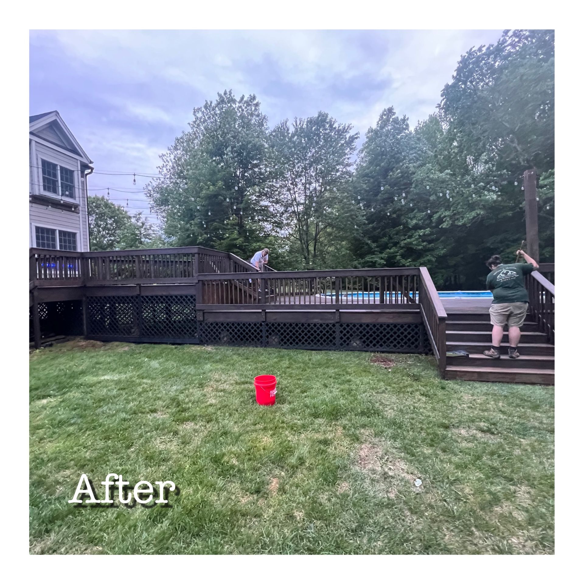 A man is standing on a deck next to a pool.