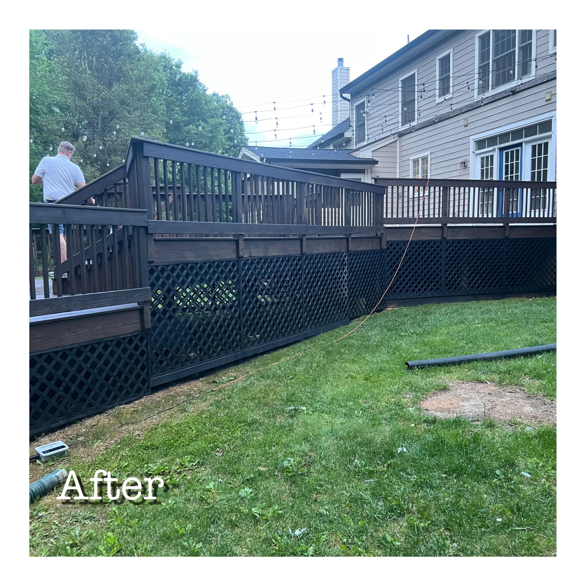 A picture of a deck after being painted black