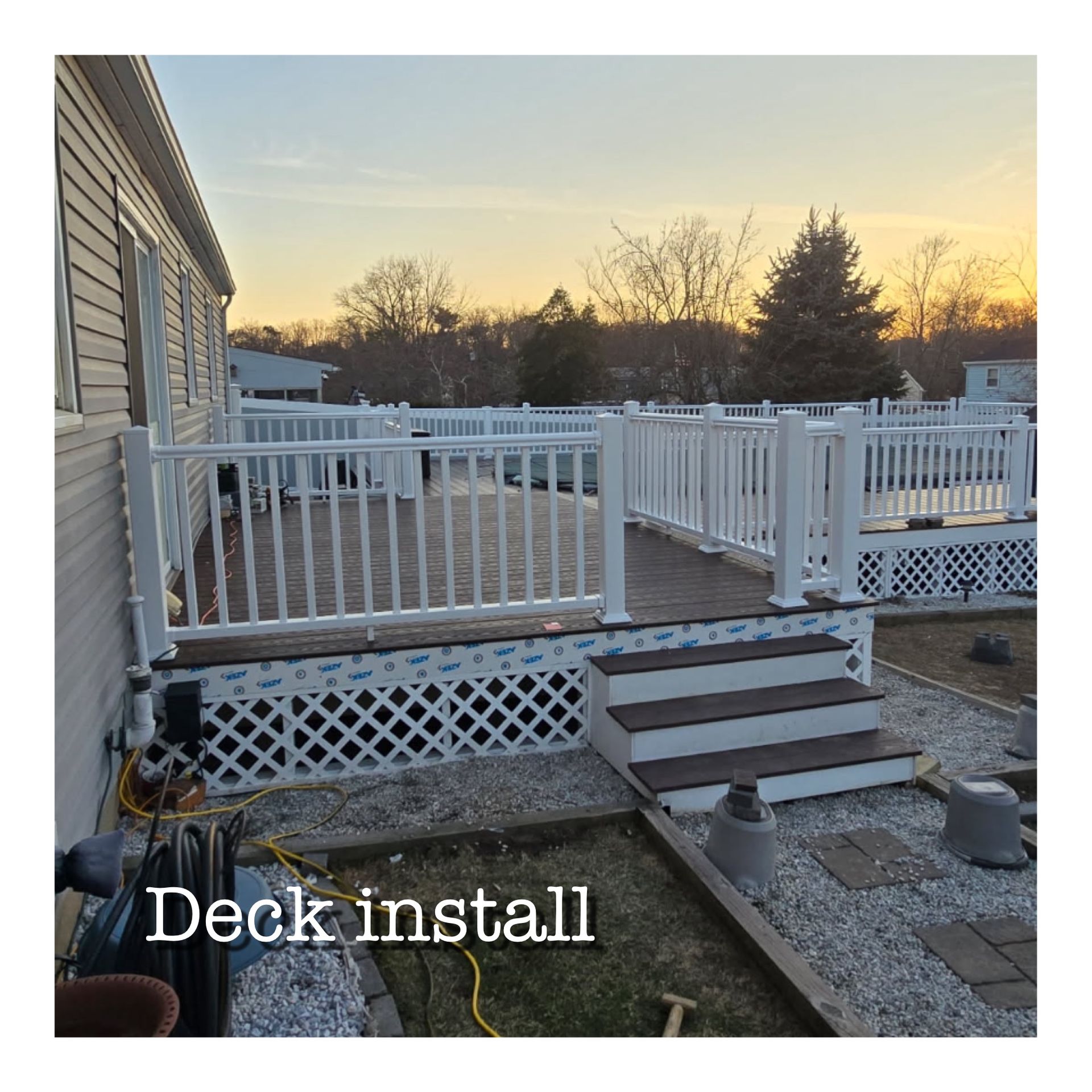 A deck is being installed in front of a mobile home