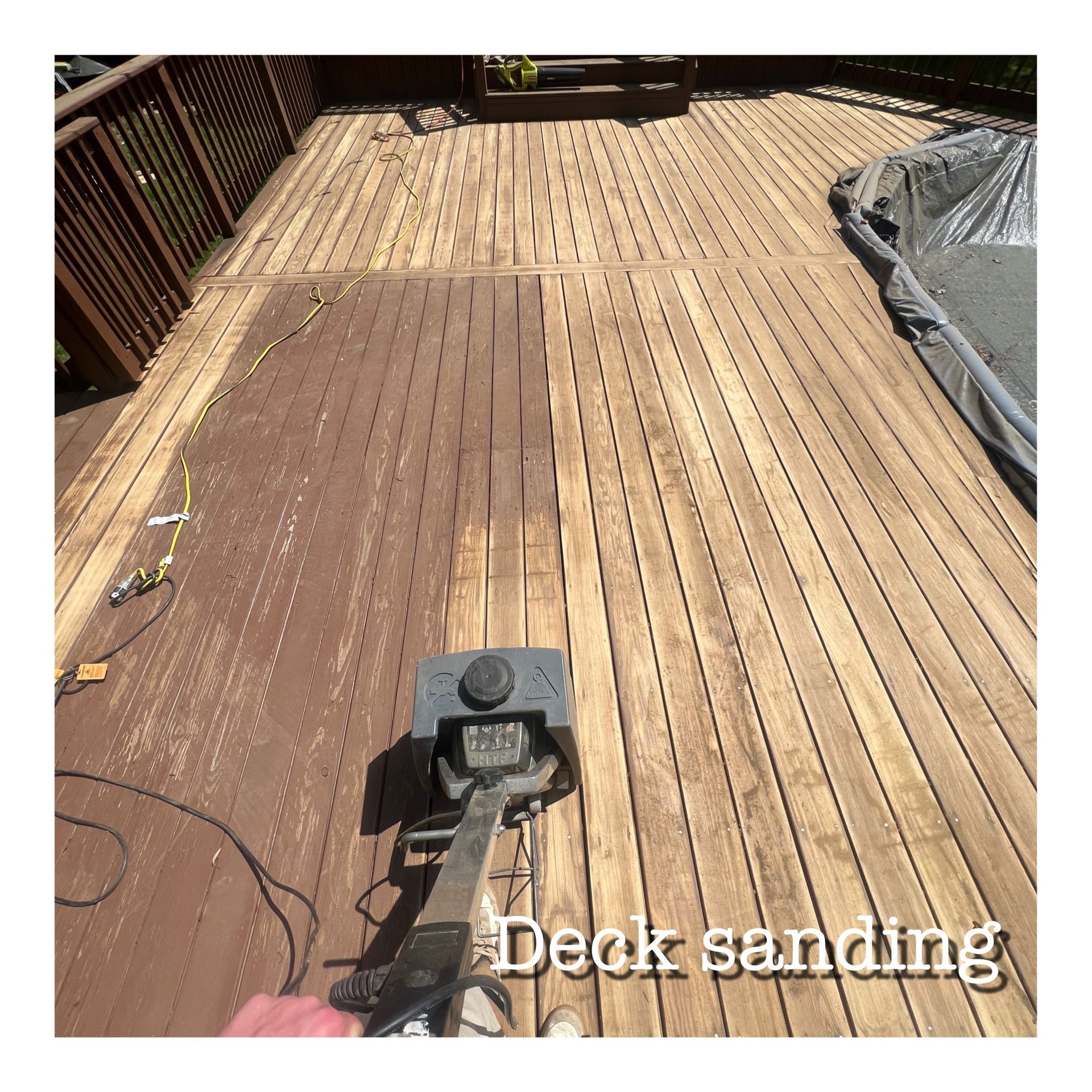 A person sanding a deck with the words deck sanding below them