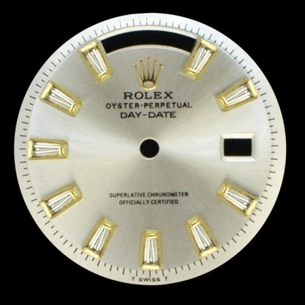 Rolex Oyster Perpetual Day-Date watch dial with gold hour markers on a silver face