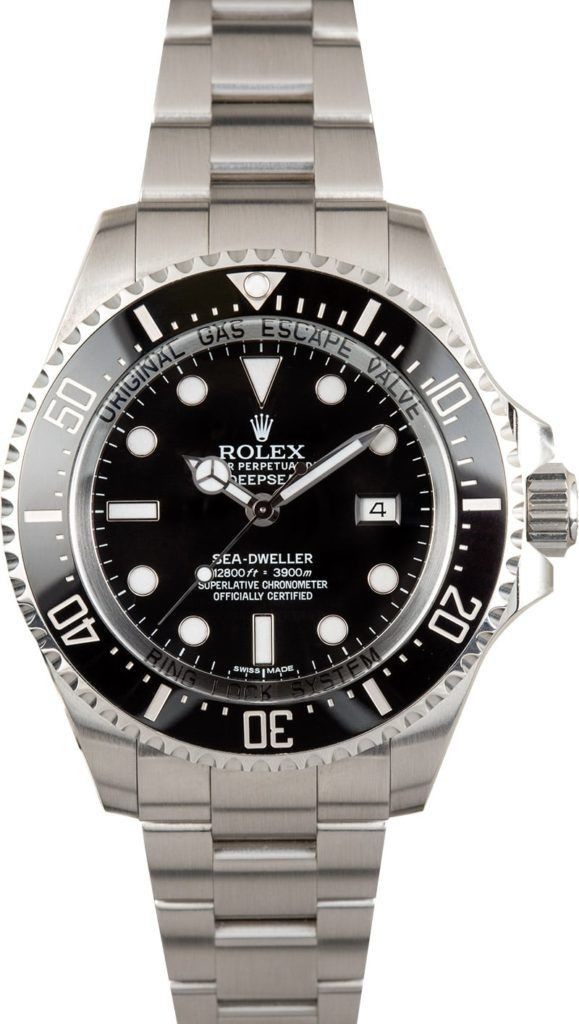 Silver Rolex wristwatch with black dial and bezel on a metal band