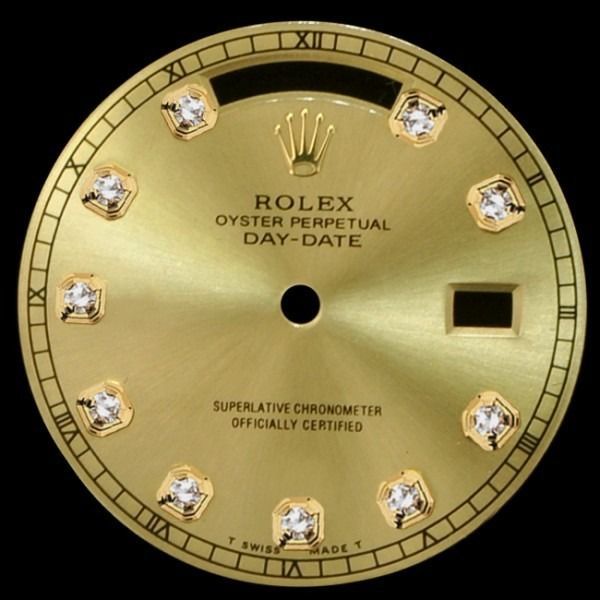 Gold Rolex President Day-Date watch dial with diamond hour markers and date window