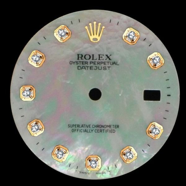 Rolex Oyster Perpetual Datejust watch dial with diamond markers and mother-of-pearl face