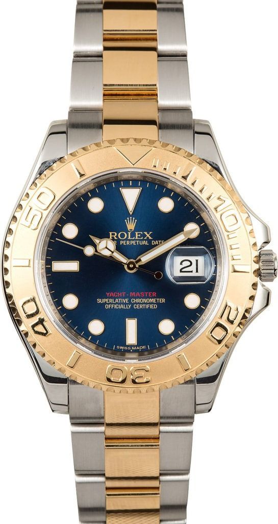 Two-tone Rolex watch with blue dial and gold bezel, showing 2:00.