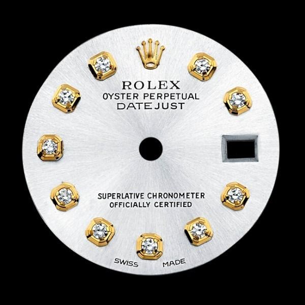 Rolex Oyster Perpetual Datejust watch dial with diamond hour markers and gold crown logo