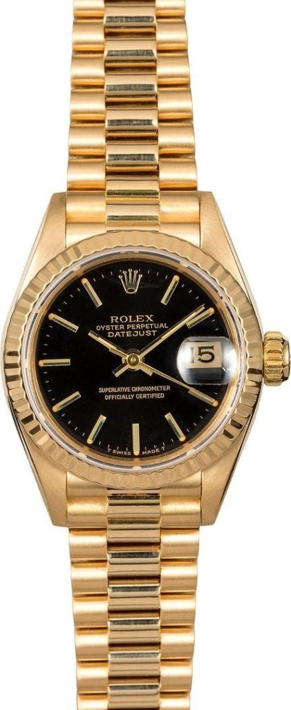 Gold wristwatch with black dial and date window