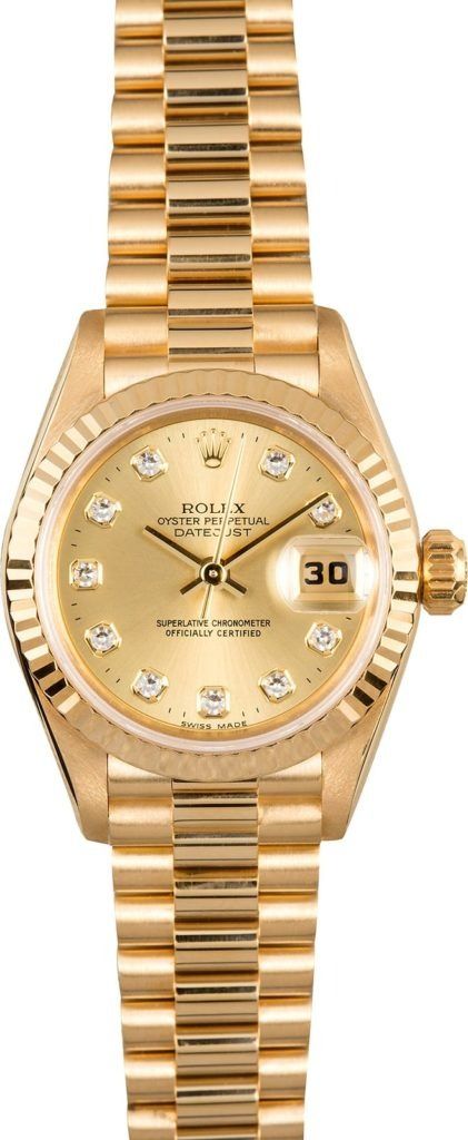 Gold wristwatch with diamond accents and a date display on the dial
