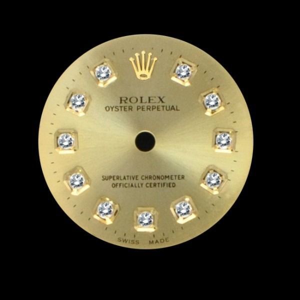 Gold Rolex Oyster Perpetual watch dial with diamond hour markers