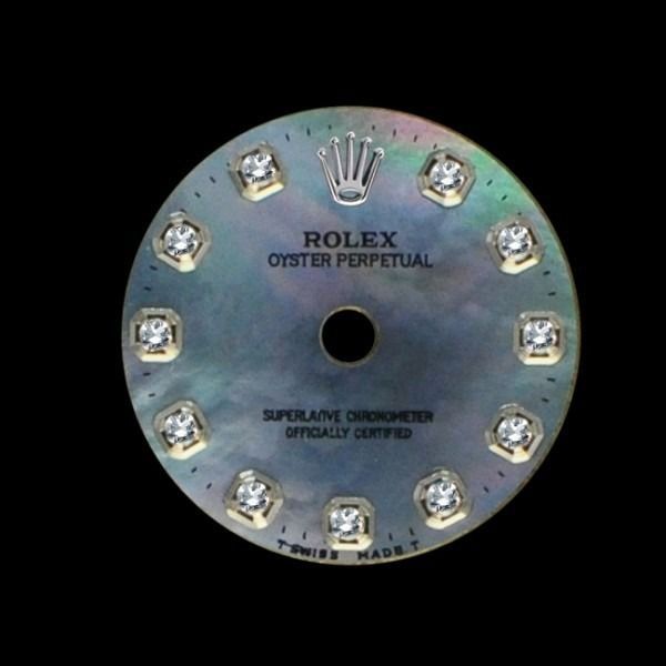 ROLEX Oyster Perpetual watch dial with iridescent face and diamond hour markers
