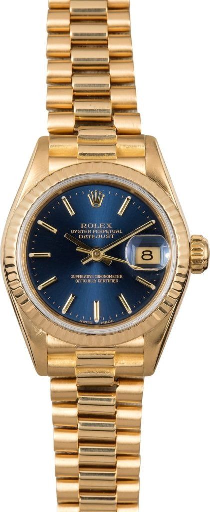 Gold wristwatch with blue dial and diamond bezel on a gold bracelet