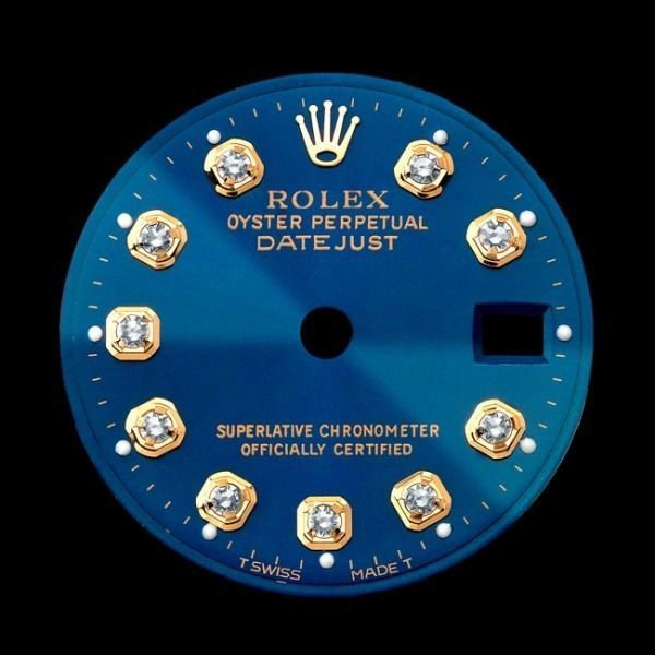 Blue Rolex Oyster Perpetual Datejust watch dial with gold markers and black center opening