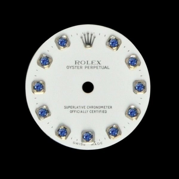 White Rolex Oyster Perpetual watch dial with blue gemstone hour markers