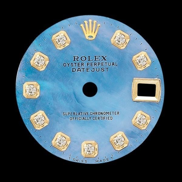 Blue Rolex Oyster Perpetual Datejust watch dial with gold crown, diamonds, and date window