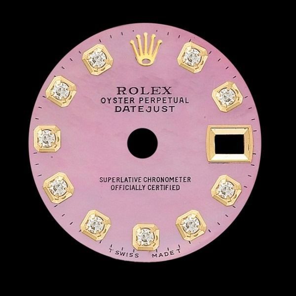 Pink Rolex Oyster Perpetual Datejust watch dial with diamond hour markers and gold crown logo