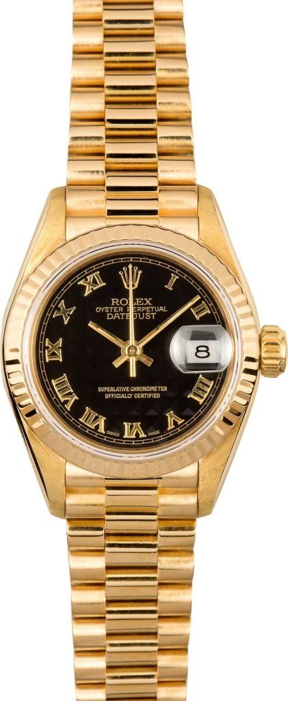 Gold wristwatch with black dial and date window on a gold bracelet