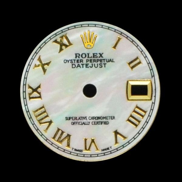 Gold Rolex Oyster Perpetual Datejust watch dial with Roman numerals and mother-of-pearl face