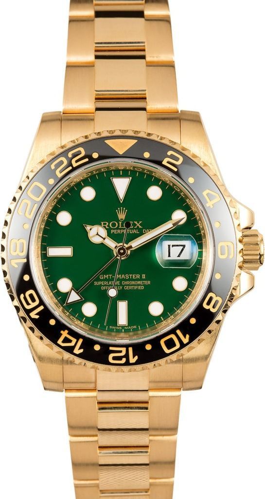 Gold Rolex GMT-Master II watch with green dial and black bezel on a gold bracelet