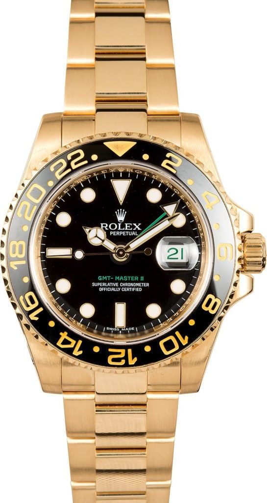 Gold Rolex-style watch with black face and gold bezel on a white background