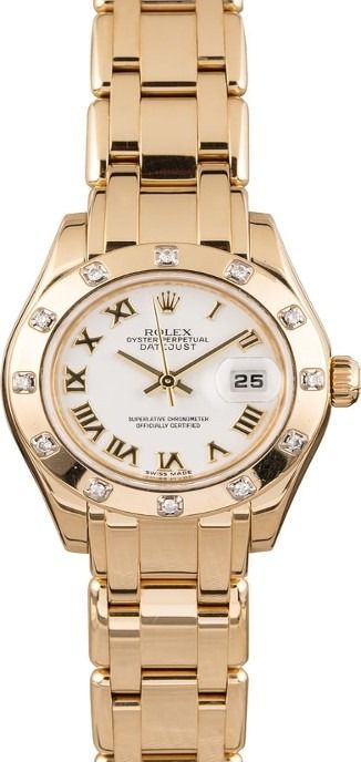 Gold wristwatch with white dial and Roman numerals on a matching metal band