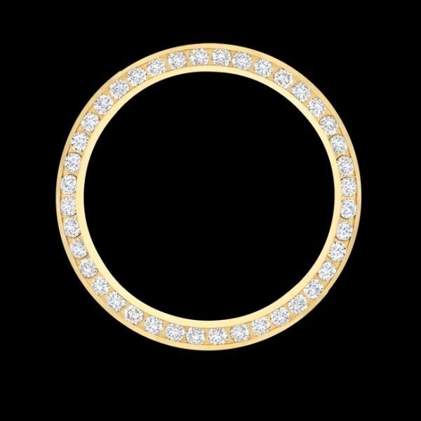 Gold ring with small clear gemstones on a black background