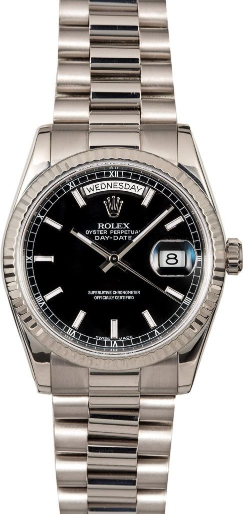 Silver Rolex watch with black dial and date display on a metal bracelet