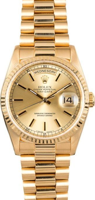 Gold Rolex wristwatch with date display and two-tone metal band on a white background