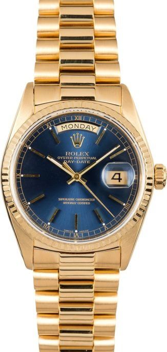 Gold Rolex watch with blue dial and date window on a gold bracelet