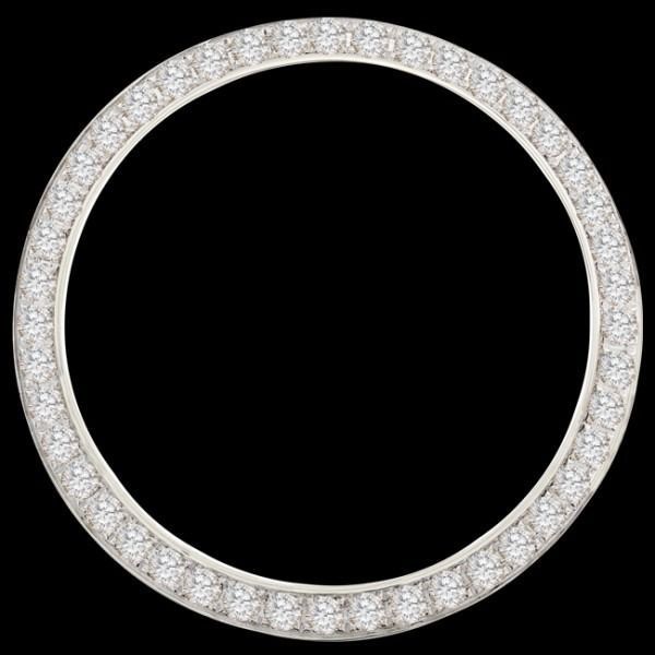 Round diamond-encrusted silver ring against a black background