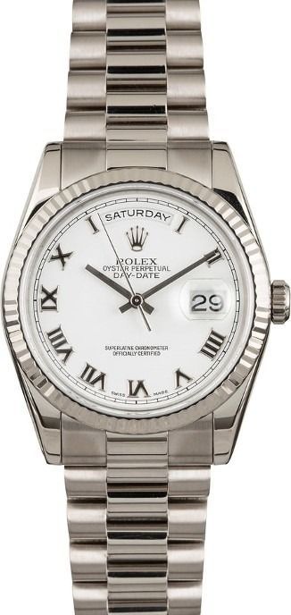 Silver Rolex wristwatch with white dial, Roman numerals, and date display on bracelet band