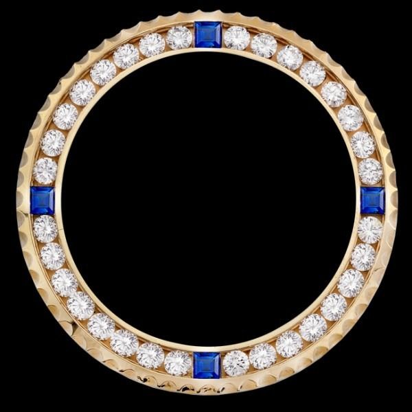 Gold ring with alternating clear and blue gemstones around a black center