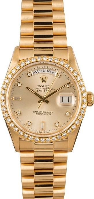 Gold Rolex watch with diamond bezel and champagne dial on a gold bracelet