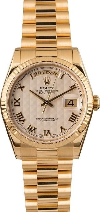 Gold Rolex wristwatch with Roman numeral dial and date display