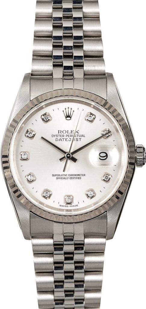 Silver wristwatch with white face and metal bracelet, showing diamond hour markers and date window