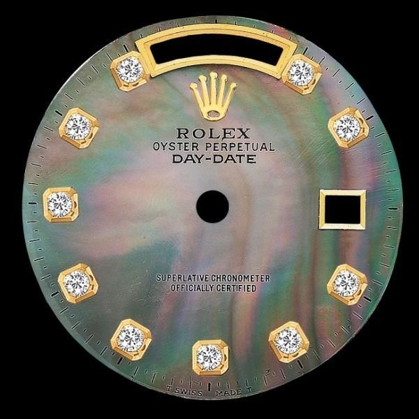 Rolex Oyster Perpetual Day-Date watch dial with iridescent face and diamond hour markers