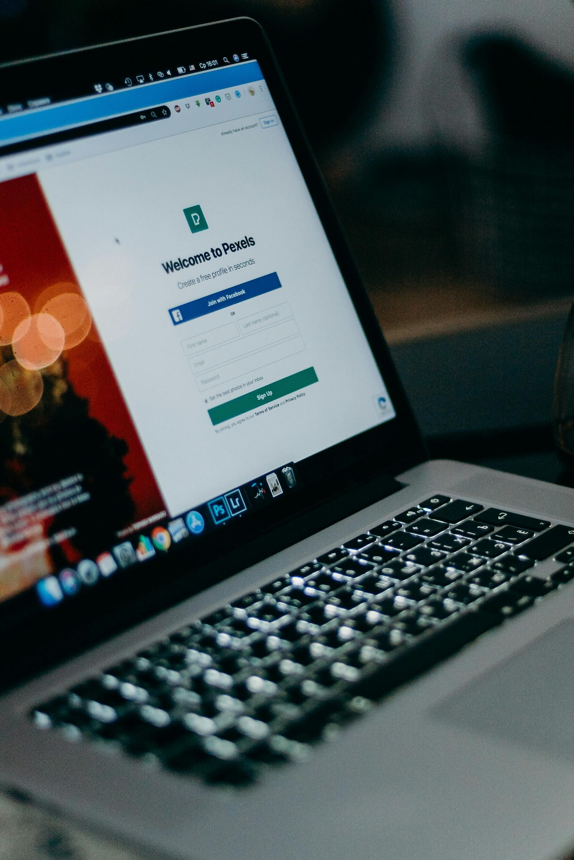 A laptop computer is open to a page with a login page on it.