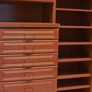 A wooden dresser with drawers and shelves in a closet.
