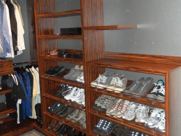 A closet filled with lots of shoes and clothes