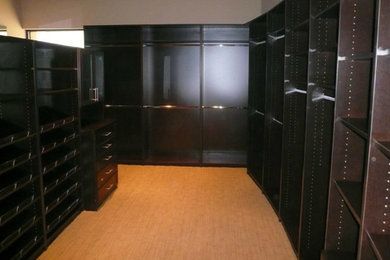 A large closet with lots of shelves and drawers